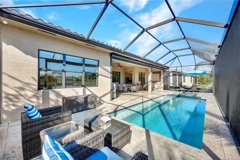 a view of a patio with table and chairs
