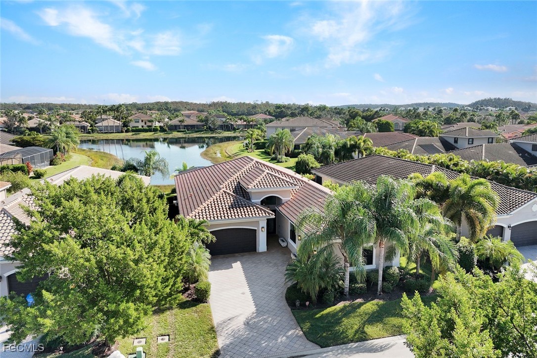 11725 Stonecreek Circle Fort Myers, FL 33913 - Photo 32 of 40 an aerial view of a house with a garden and lake view