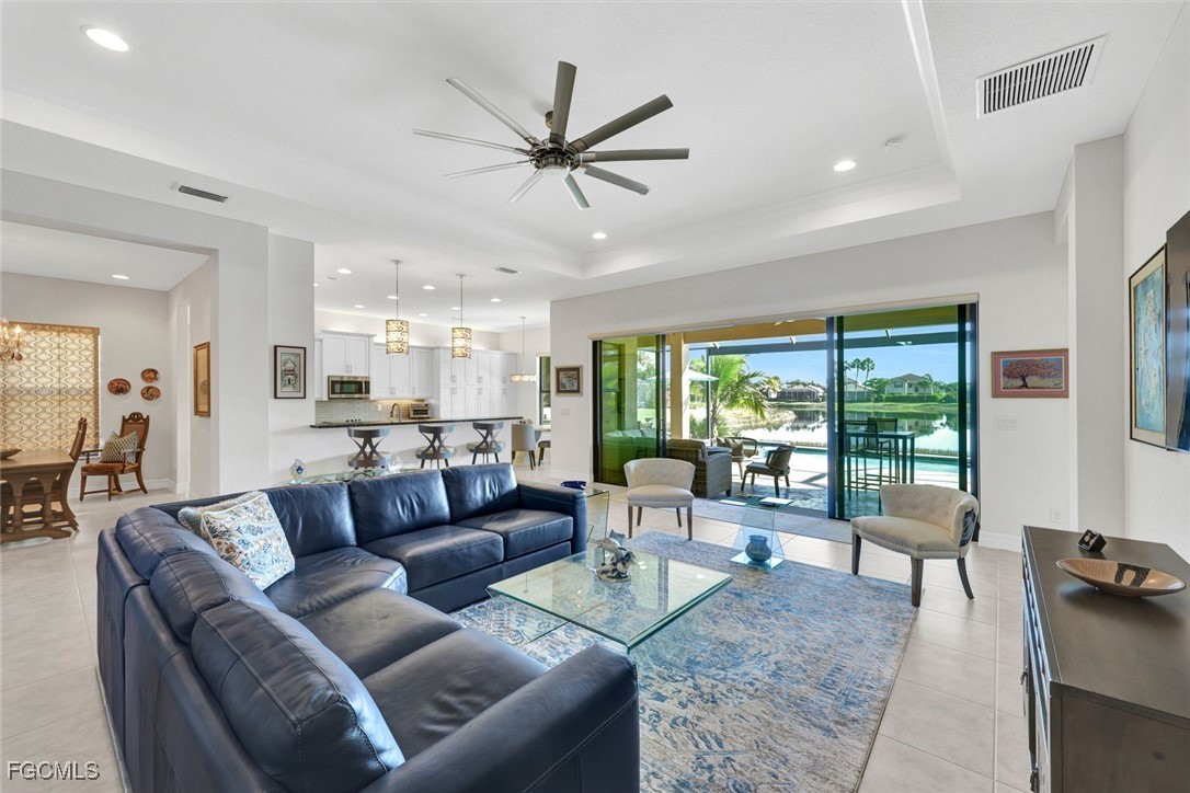 11725 Stonecreek Circle Fort Myers, FL 33913 - Photo 5 of 40 a living room with furniture and a large window