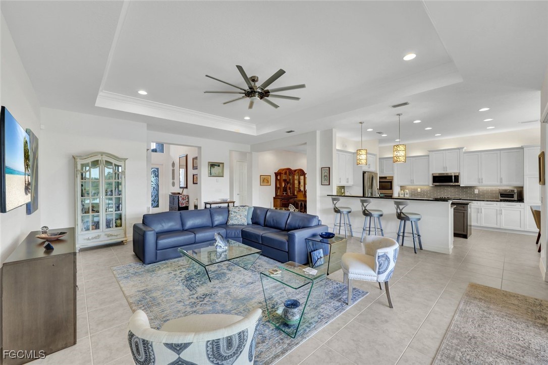 11725 Stonecreek Circle Fort Myers, FL 33913 - Photo 7 of 40 a living room with furniture and view of kitchen