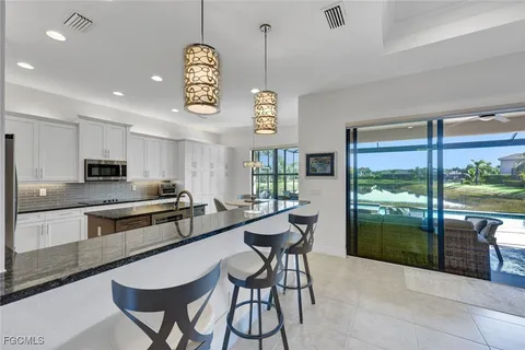 a view of a dining room with furniture window and outside view