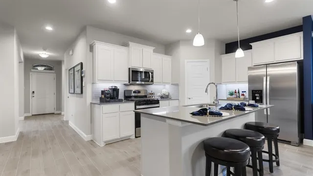 a view of a chairs in backyard of the house