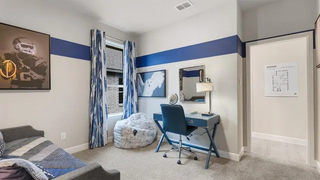 a living room with furniture and a lamp