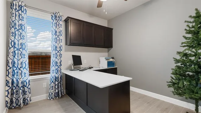 a bathroom with a bathtub shower and a sink