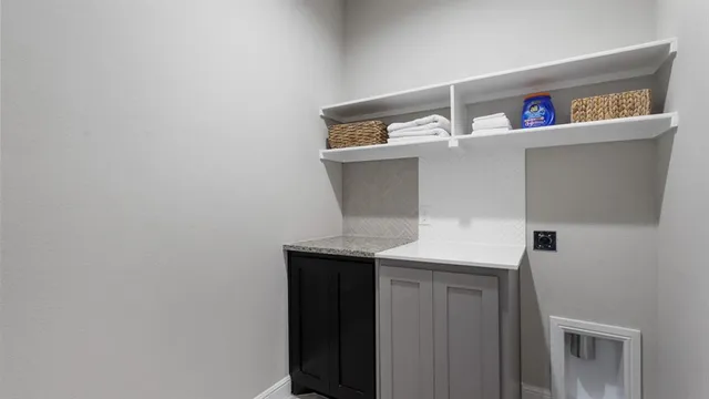 a kitchen that has a microwave and a stove in it