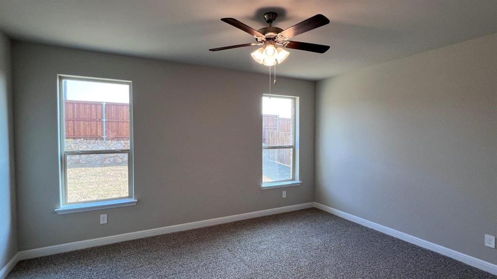 125 Medina Lane Rhome, TX 76078 - Photo 5 of 21 an empty room with a window