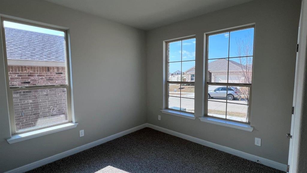 125 Medina Lane Rhome, TX 76078 - Photo 8 of 21 an empty room with a window