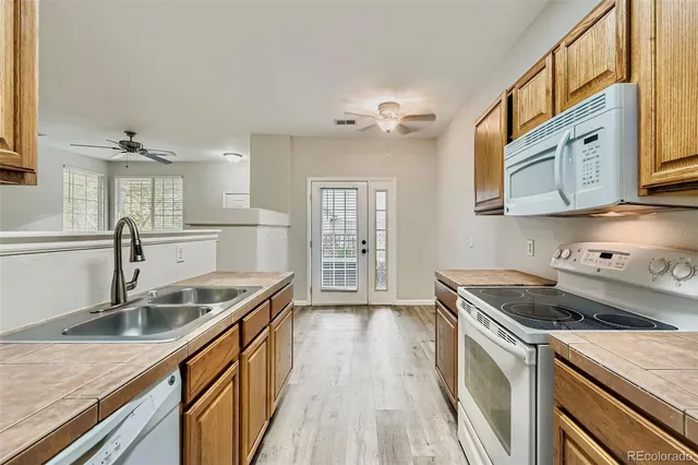 a kitchen that has a sink and a stove