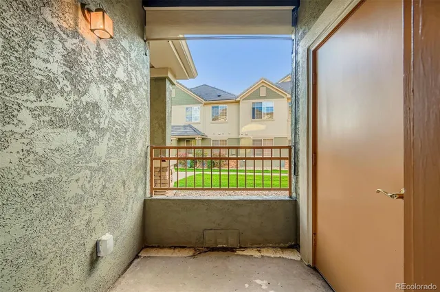 a front view of a house with a street