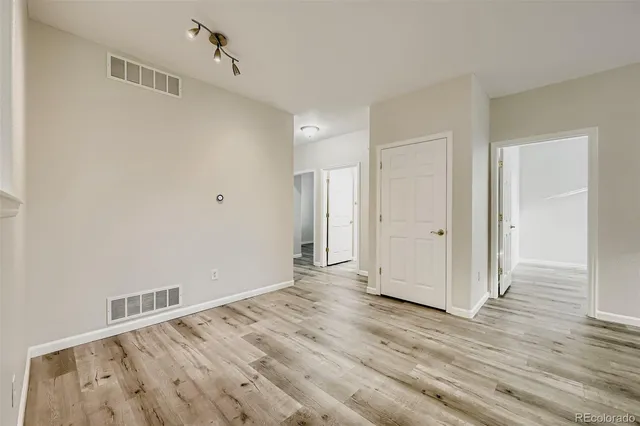 a view of a livingroom with wooden floor