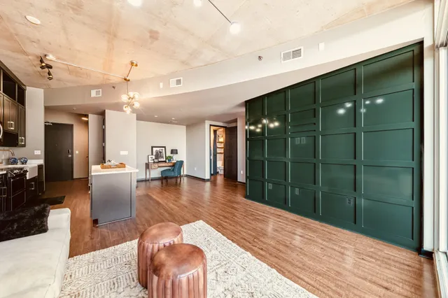 a lobby with furniture and floor to ceiling window