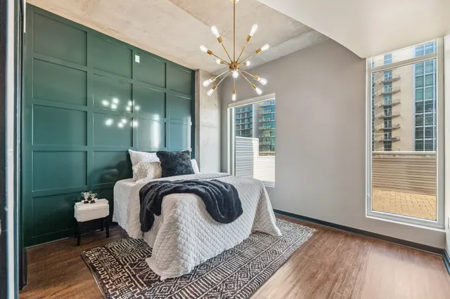 a spacious bedroom with a bed and window