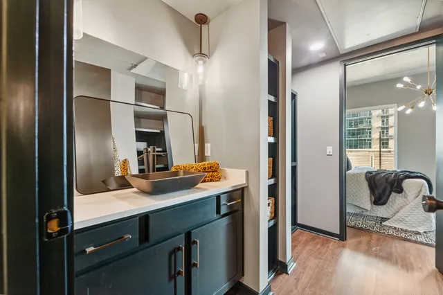 a bathroom with a sink double vanity and a mirror