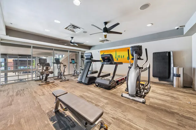a very nice looking room with gym equipment
