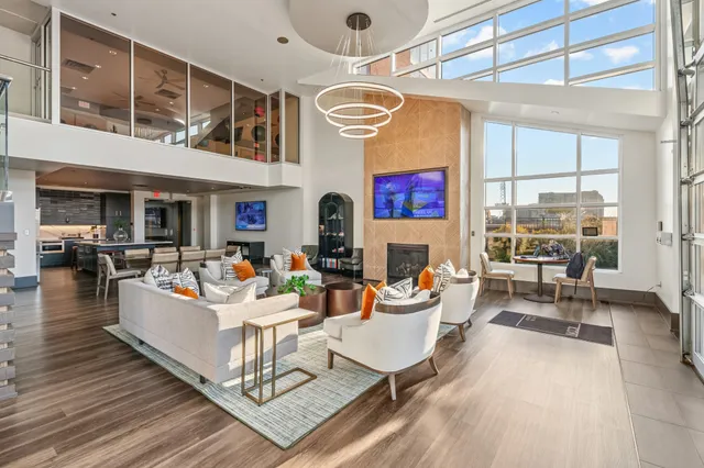 a living room with fireplace furniture and a wooden floor