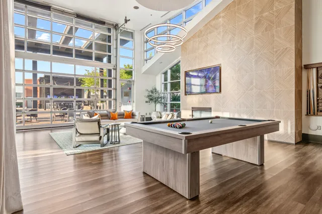 a view of a chairs and table in the balcony