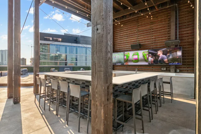 an open kitchen with cabinets and wooden floor