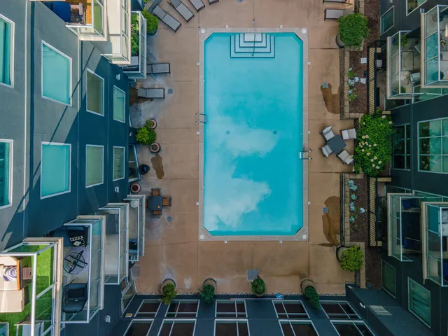 a view of a patio with couches and potted plants