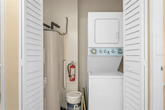 a bathroom with a toilet and a shower curtain