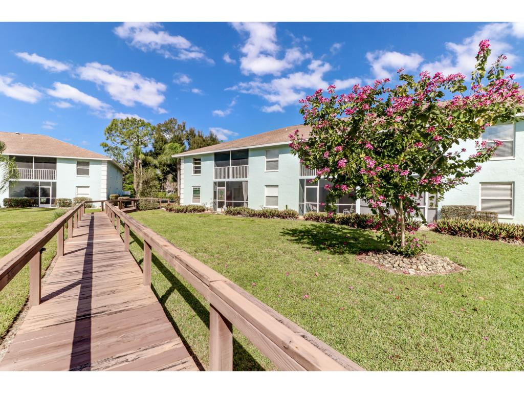 5739 Whitaker Road, Unit 103 Naples, FL 34112 - Photo 14 of 18 a view of a house with entertaining space
