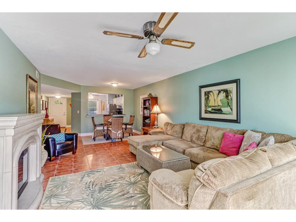 5739 Whitaker Road, Unit 103 Naples, FL 34112 - Photo 4 of 18 a living room with furniture and a couch