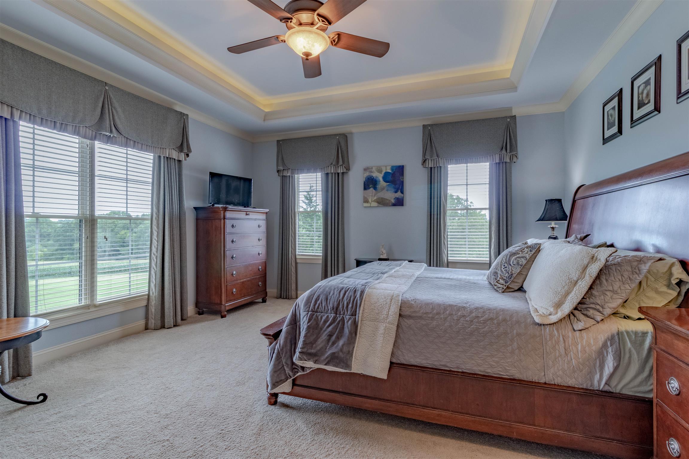 2687 Gunn Road Adams, TN 37010 - Photo 11 of 30 a bedroom with a bed and large windows