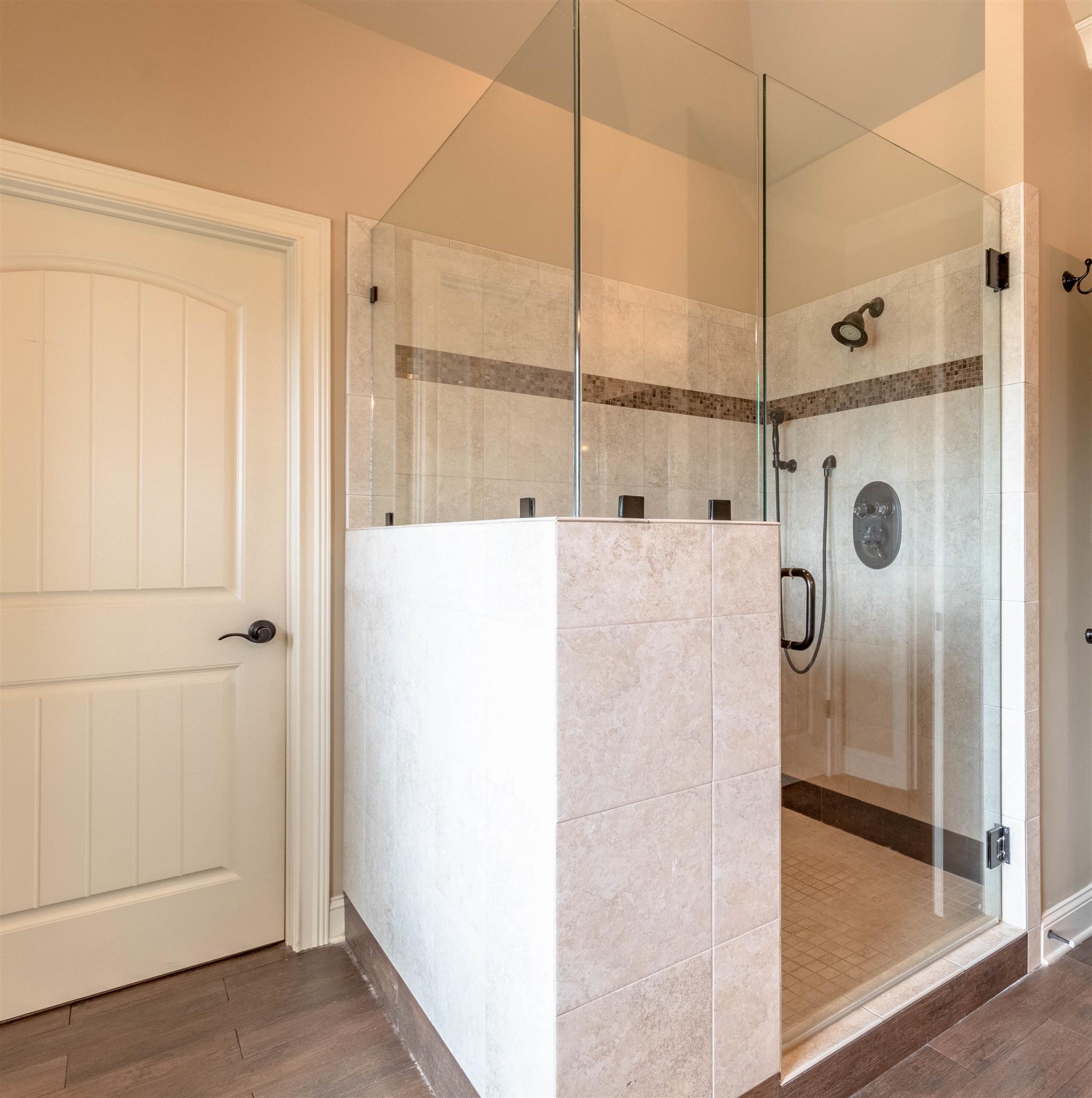 2687 Gunn Road Adams, TN 37010 - Photo 13 of 30 a bathroom with a shower and a glass door