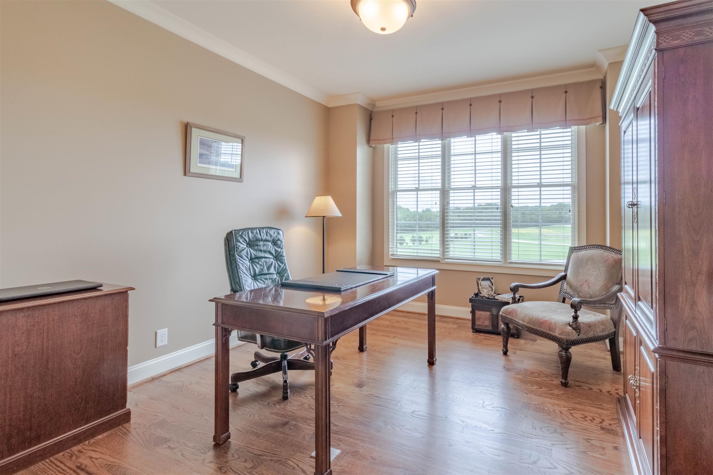2687 Gunn Road Adams, TN 37010 - Photo 14 of 30 a work room with furniture and wooden floor