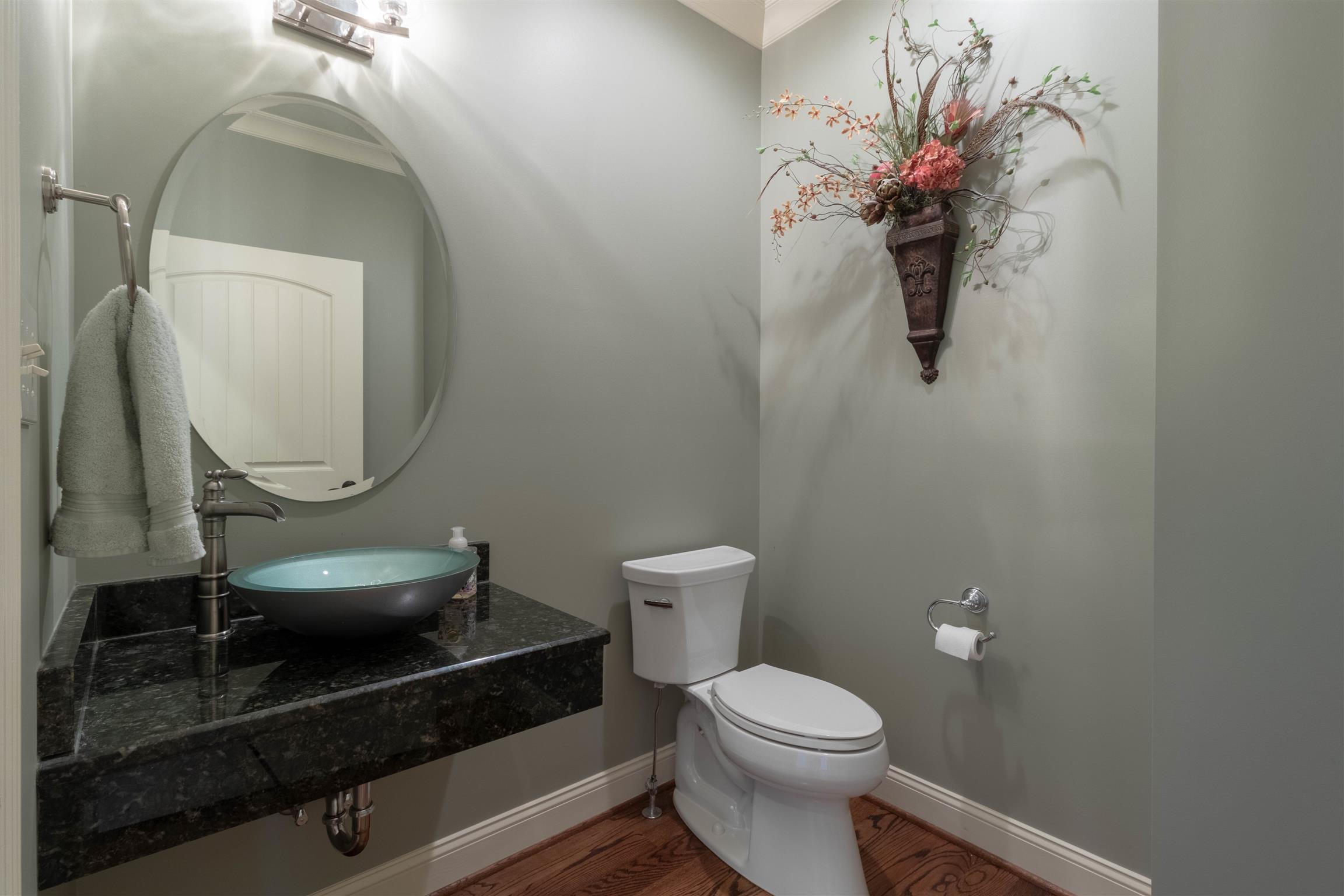 2687 Gunn Road Adams, TN 37010 - Photo 15 of 30 a bathroom with a toilet a sink and mirror