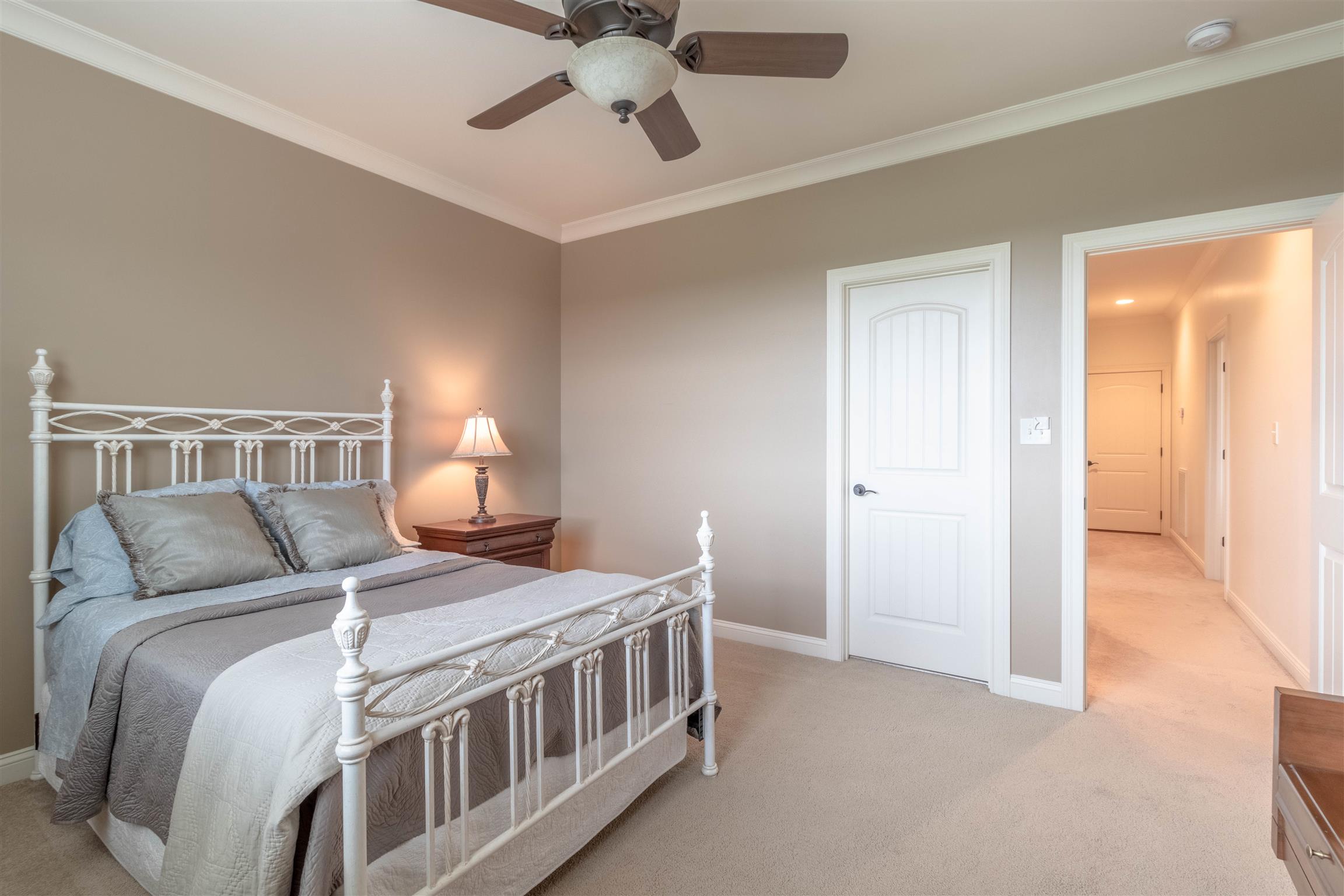 2687 Gunn Road Adams, TN 37010 - Photo 19 of 30 a bedroom with a bed and a chandelier