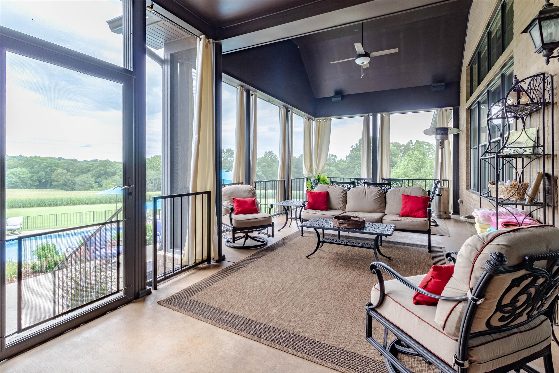 2687 Gunn Road Adams, TN 37010 - Photo 24 of 30 a living room with furniture and a floor to ceiling window
