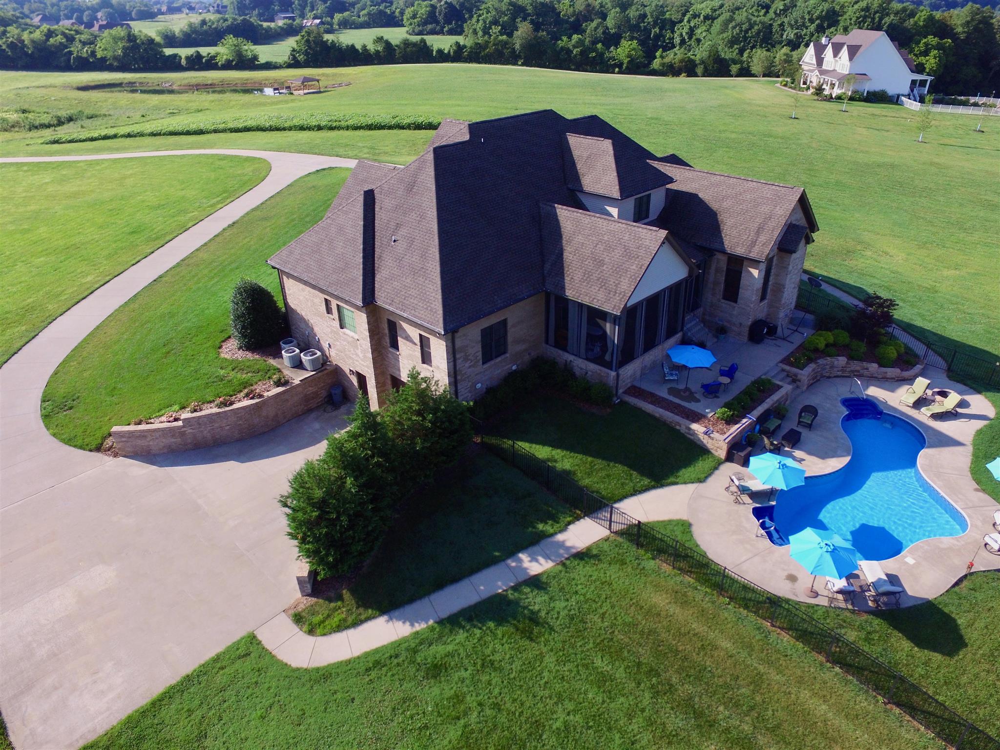 2687 Gunn Road Adams, TN 37010 - Photo 29 of 30 an aerial view of a house with a garden and a swimming pool