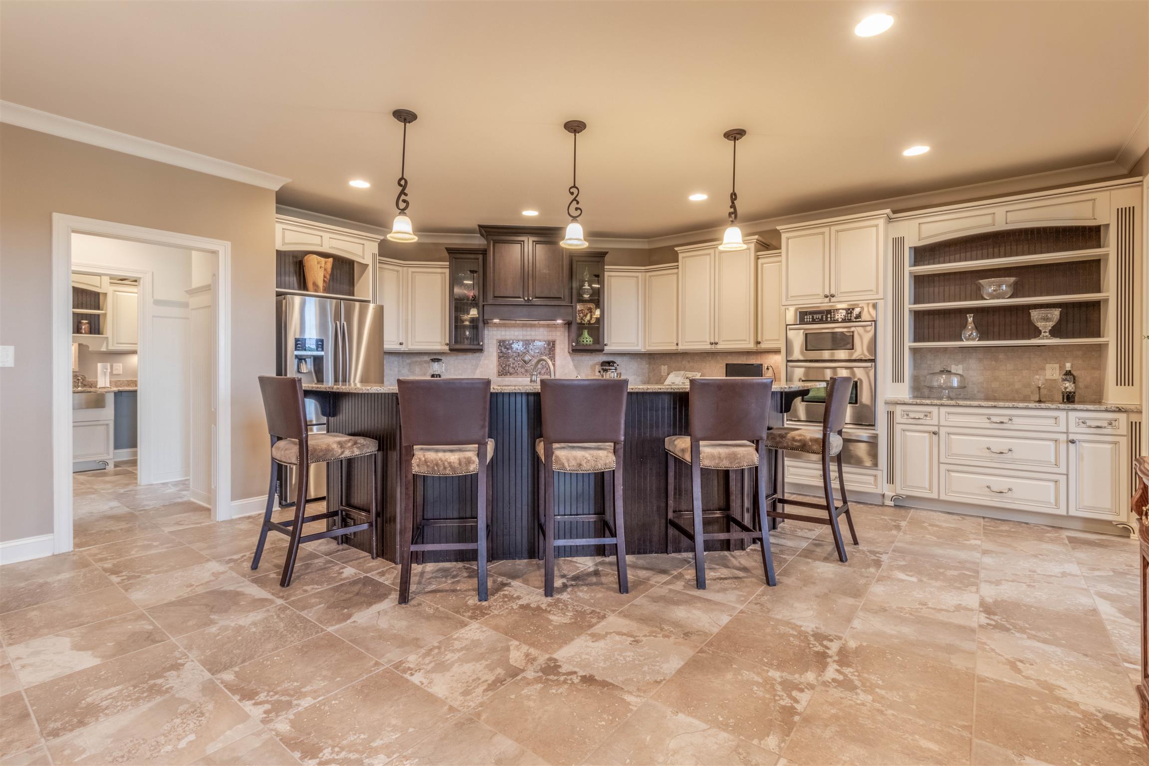2687 Gunn Road Adams, TN 37010 - Photo 4 of 30 a large kitchen with a table and chairs
