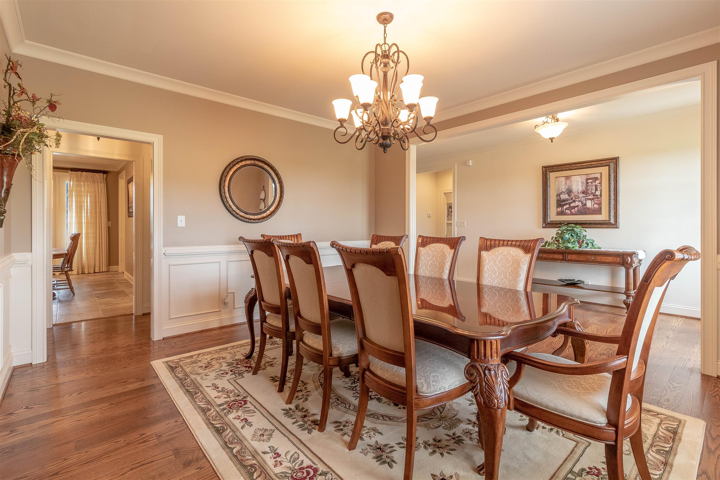 2687 Gunn Road Adams, TN 37010 - Photo 6 of 30 a view of a dining room with furniture a chandelier and wooden floor