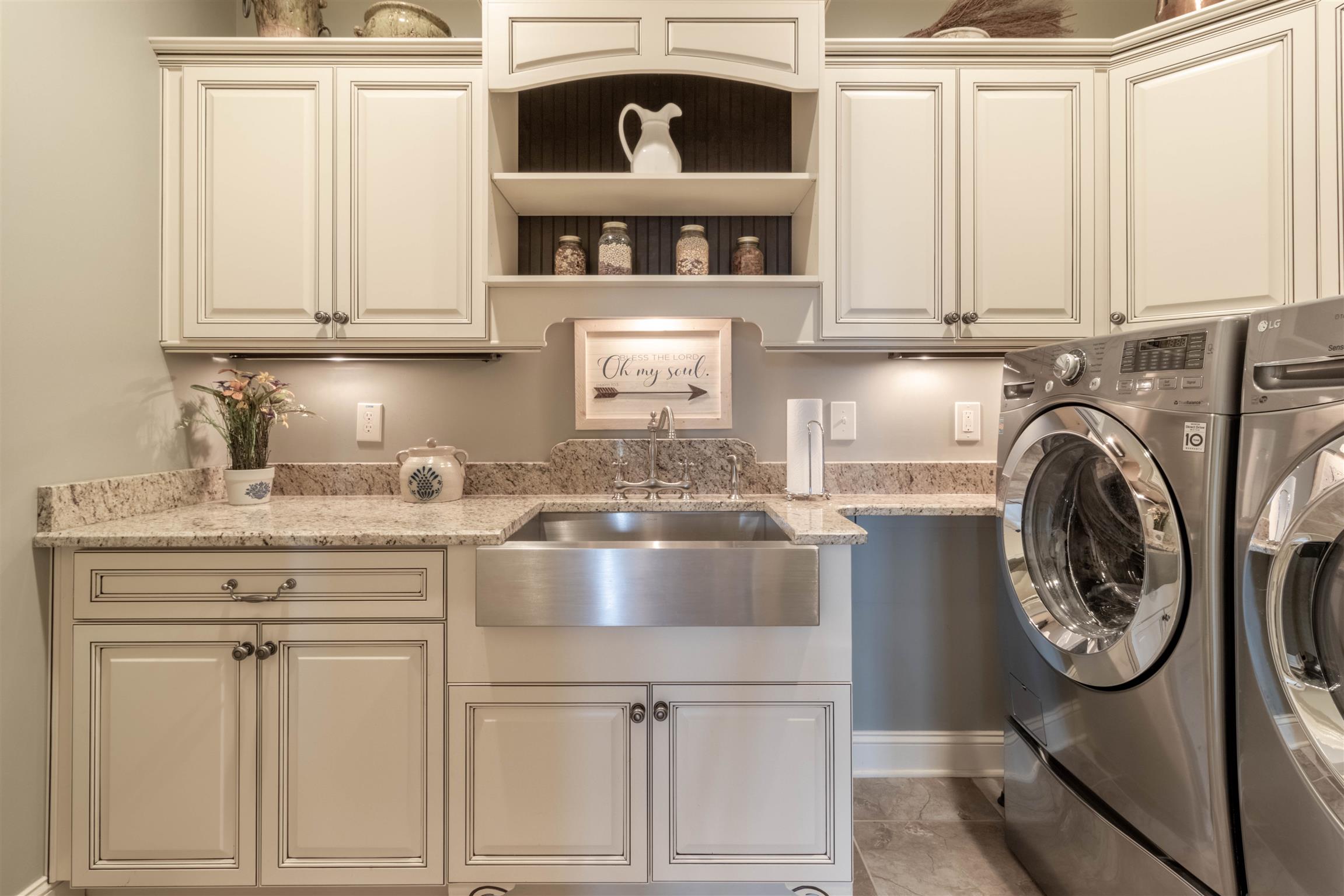 2687 Gunn Road Adams, TN 37010 - Photo 8 of 30 a kitchen with white cabinets and sink