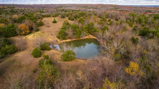 a view of a lake with a yard and mountain view