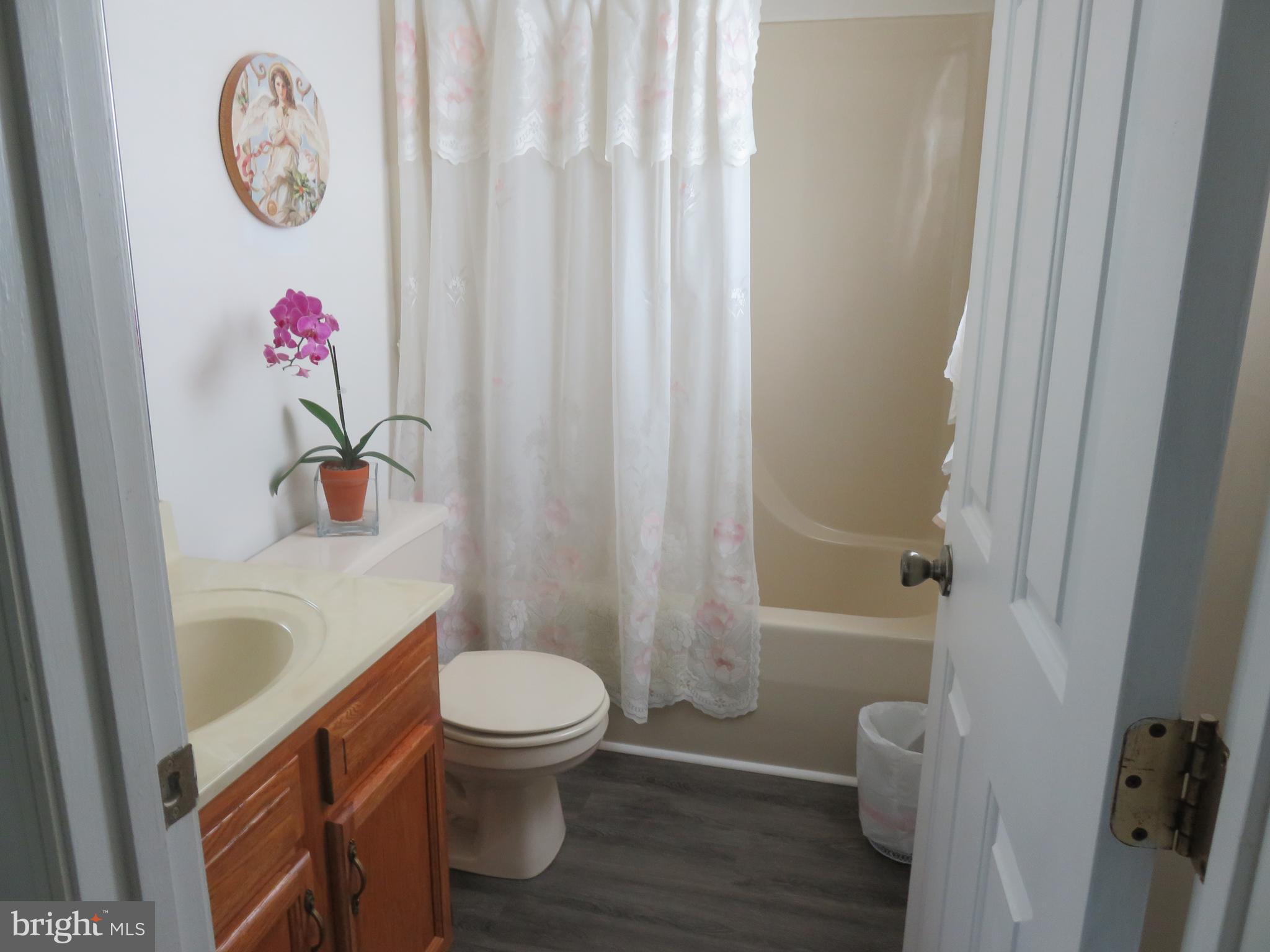 6907 Quail Run Hurlock, MD 21643 - Photo 18 of 30 Master bath with new LVP flooring