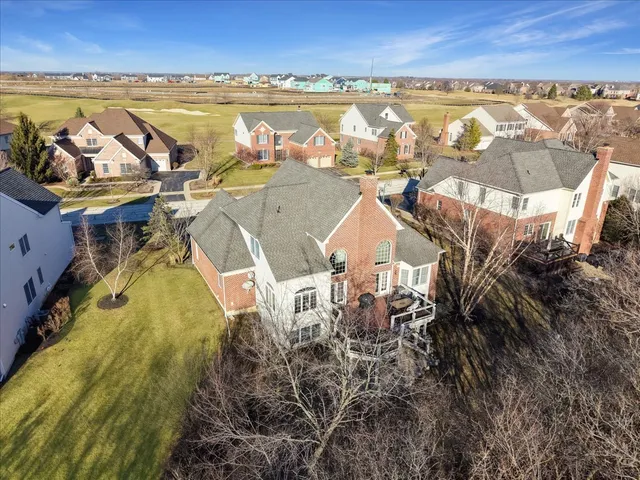 an aerial view of residential building and ocean