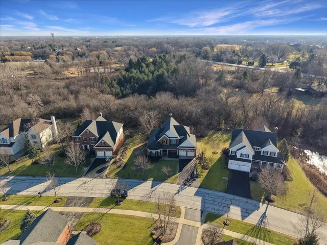 an aerial view of a house with outdoor space