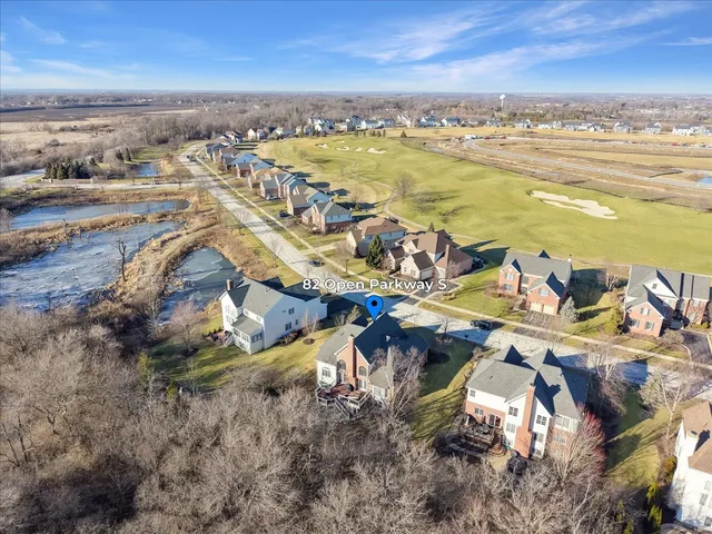 an aerial view of residential building with ocean view