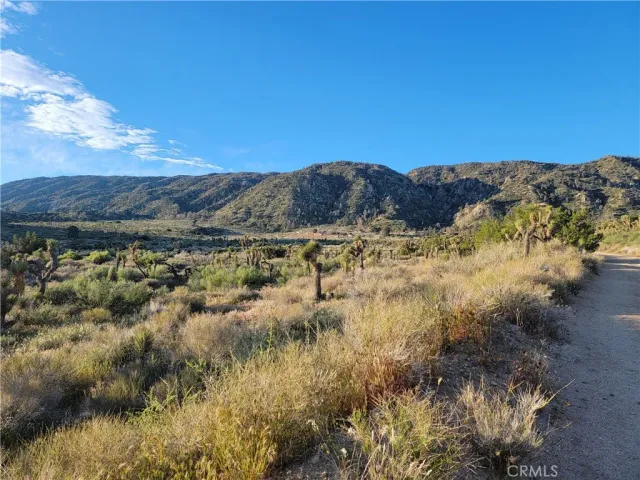 a view of mountain with sunset