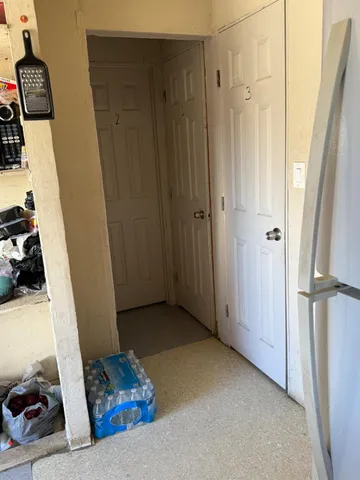 a view of bedroom with a bed and wooden floor