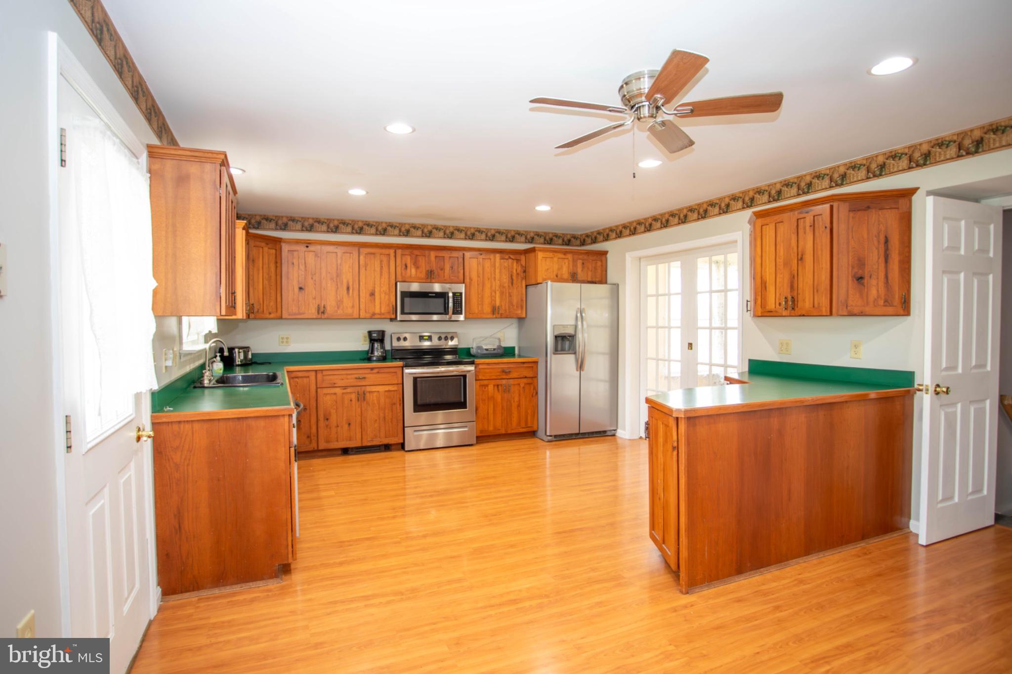 161 Coyote Run Mathias, WV 26812 - Photo 13 of 88 Spacious kitchen with warm wood accents.