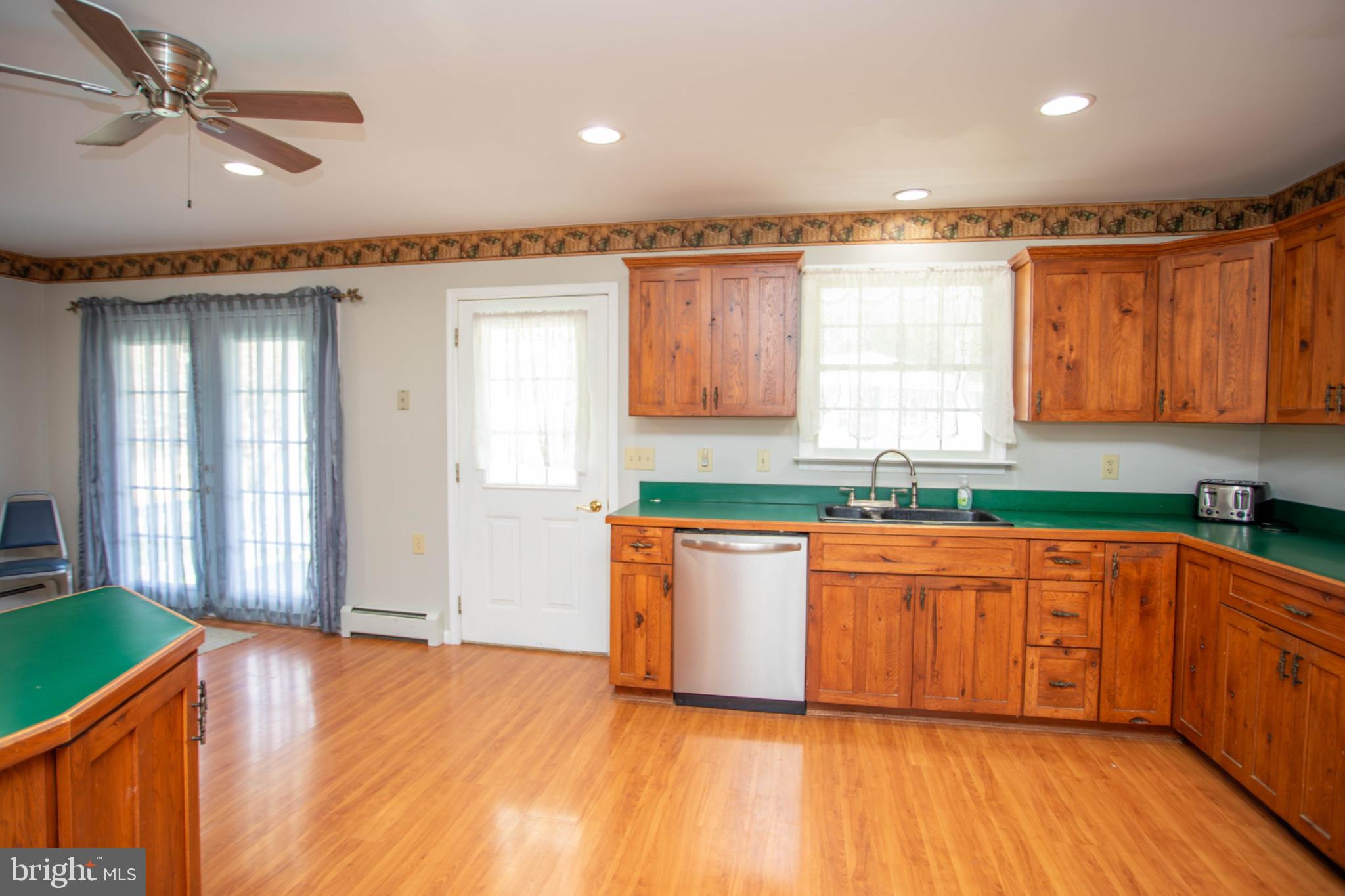 161 Coyote Run Mathias, WV 26812 - Photo 14 of 88 Warm wood tones in a bright kitchen.