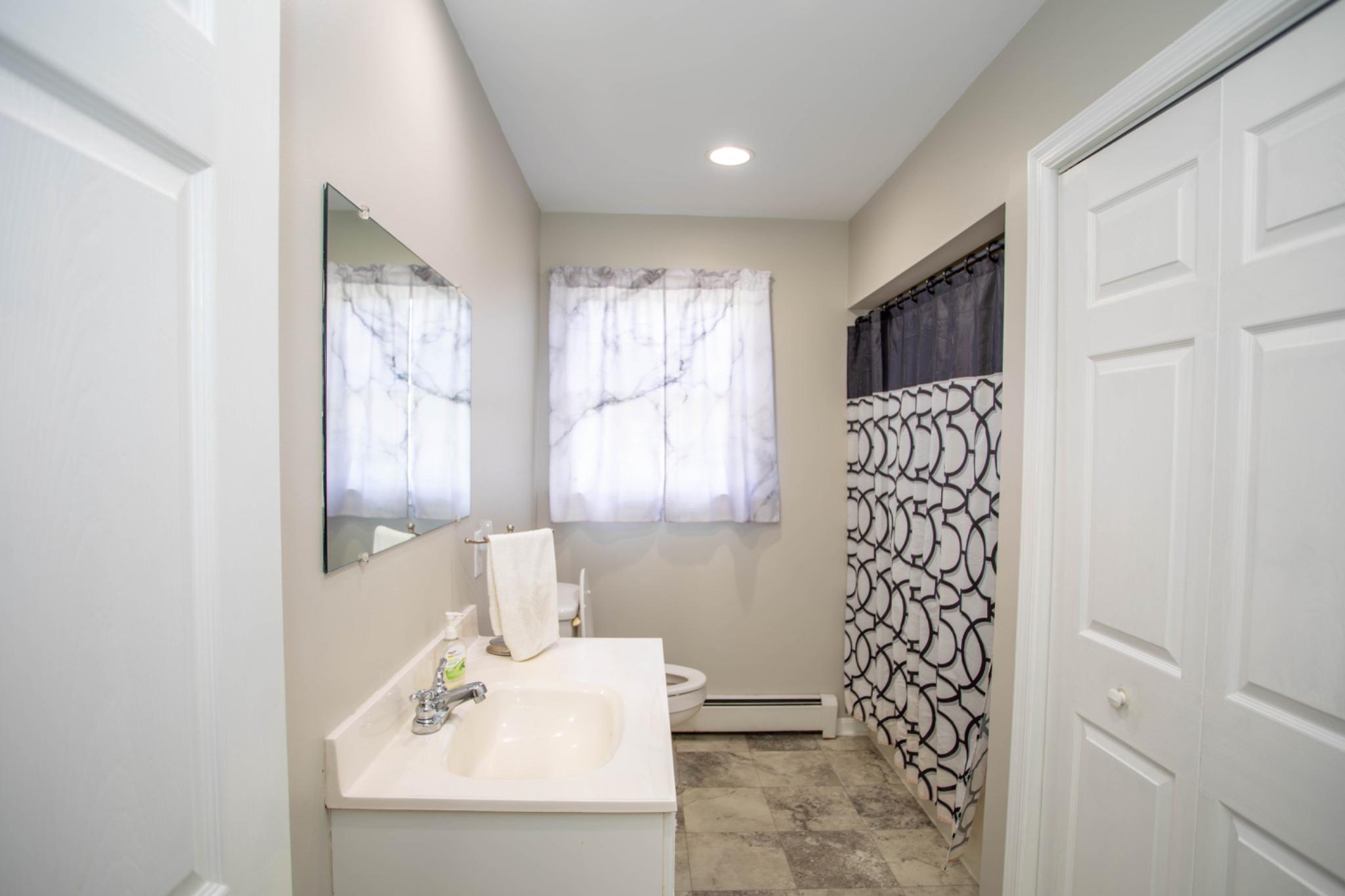 161 Coyote Run Mathias, WV 26812 - Photo 42 of 88 Bright and air entry level bathroom retreat.