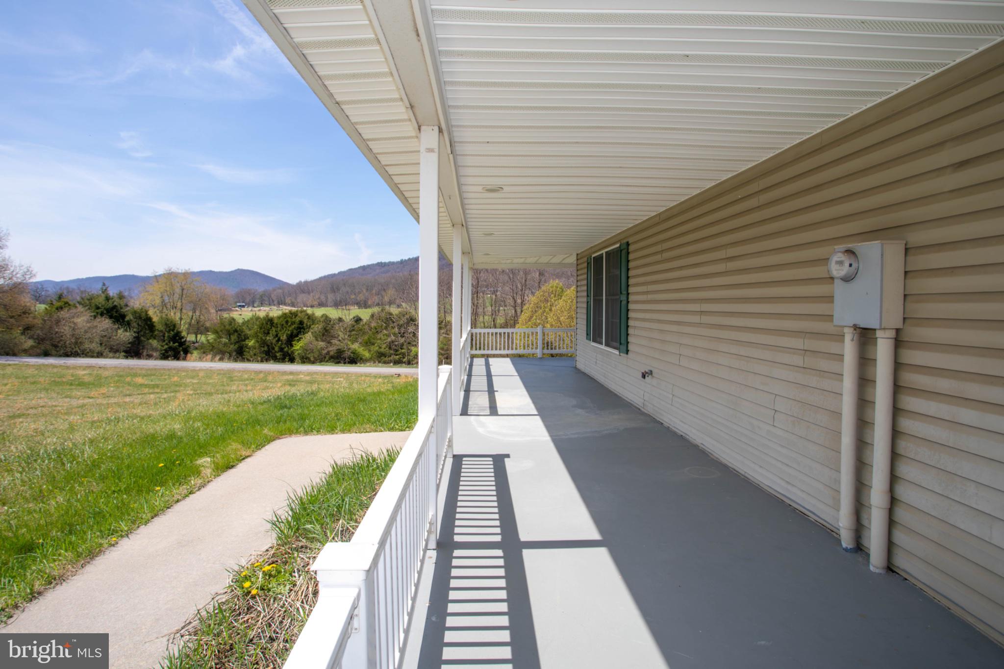 161 Coyote Run Mathias, WV 26812 - Photo 5 of 88 Serene porch with mountain views.