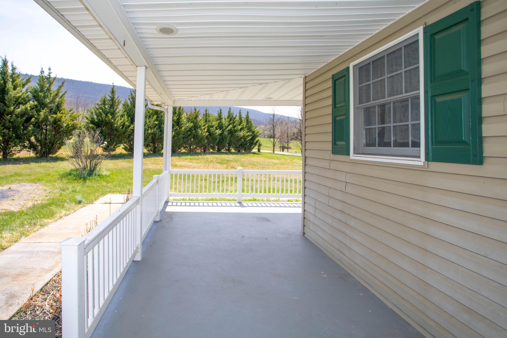 161 Coyote Run Mathias, WV 26812 - Photo 6 of 88 Charming porch with scenic views.