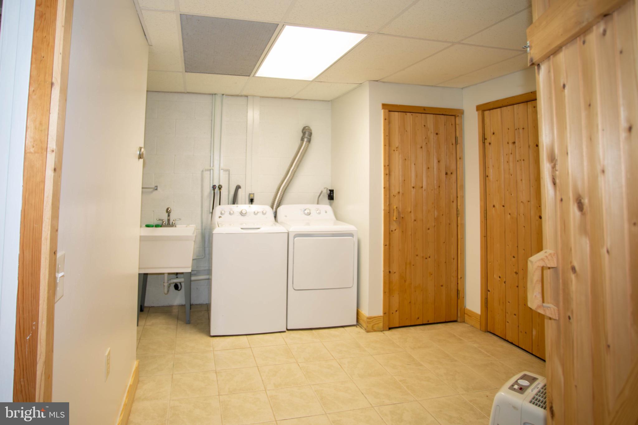 161 Coyote Run Mathias, WV 26812 - Photo 76 of 88 Bright and functional laundry space.