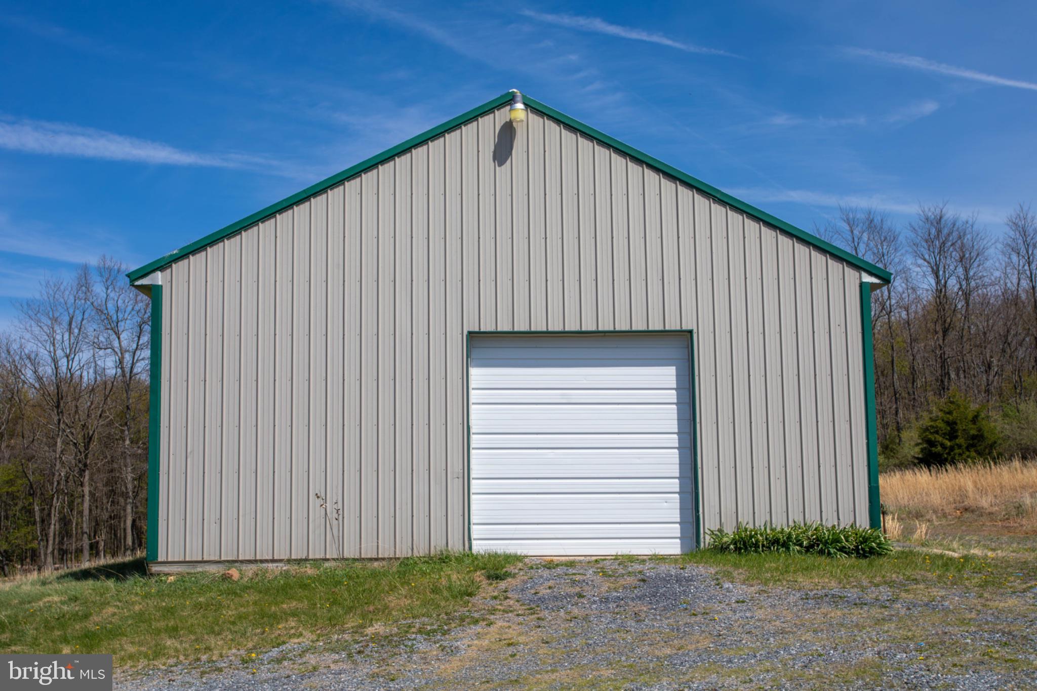 161 Coyote Run Mathias, WV 26812 - Photo 86 of 88 Spacious barn with a serene backdrop.