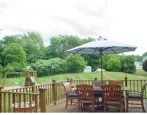 1 Stoneybrook Road Grafton, MA 01536 - Photo 11 of 30 a view of table and chairs under an umbrella
